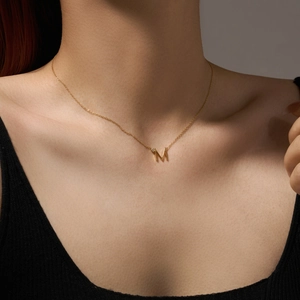 Minimalist S925 sterling silver necklace featuring letter M pendant with a sparkling zircon