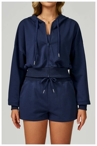 Detail of navy blue zip-up hoodie set with ribbed cuffs and matching drawstring shorts