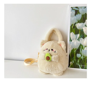 Plush cat-shaped crossbody bag holding a green avocado with soft cream faux fur detail