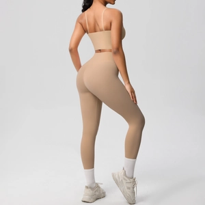 Close-up of matte nude yoga set showing open back sports bra and high-waist leggings