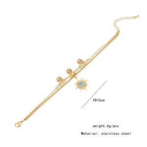 Detail view of double-layer stainless steel star bracelet with turquoise and beads