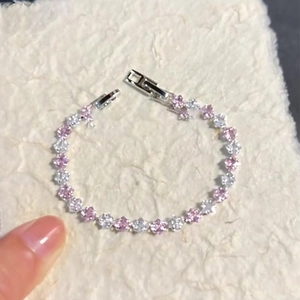 Elegant silver bracelet with pink and white zircon floral patterns and snap closure