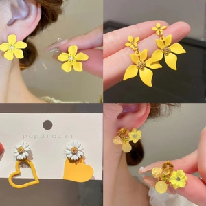 Elegant yellow floral earrings set with synthetic crystals and petal design detail