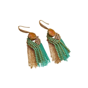 Bohemian gold tassel earrings with orange teardrop stone and green beads in a layered style