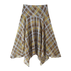 Detail of plaid midi skirt with irregular hem in brown and yellow tones on white background