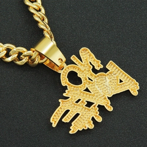 Close-up of golden cuban link necklace with iced-out Chinese Fa character pendant