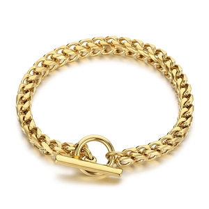 Gold stainless steel dragon bone chain bracelet with OT toggle clasp on white background