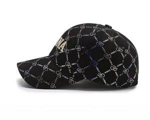 Detail of gold CHINA embroidery on black baseball cap with holographic logo pattern
