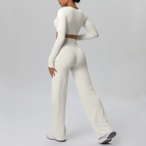 Detail view of the high-waist wide-leg pants and cropped long sleeve top athletic set