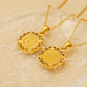 Elegant gold round coin pendant necklace featuring an embossed letter C design