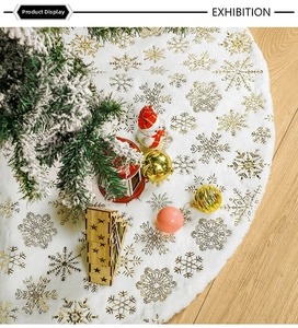 Detailed view of white faux fur Christmas tree skirt with golden foil snowflake patterns