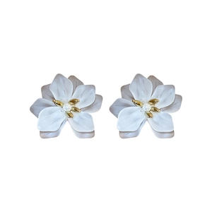 Elegant white floral petal earrings with faux pearl center and golden stamens on white background