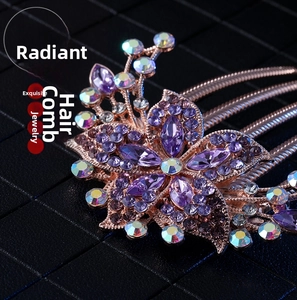 Detail of purple crystal floral hair comb with rose gold metal prongs for women