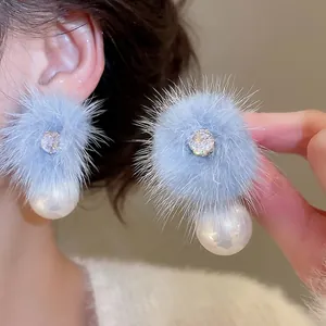 Light blue pom-pom pearl stud earrings with 18K gold plating and zircon accents