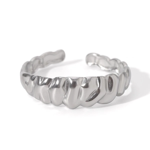 Detailed view of silver croissant ring featuring a unique pleated metal texture