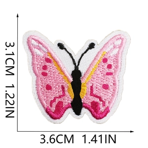 Macro detail of pink butterfly embroidery patch with precise size measurements