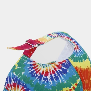 Detail view of the metal buckle and adjustable strap on the tie-dye baseball cap
