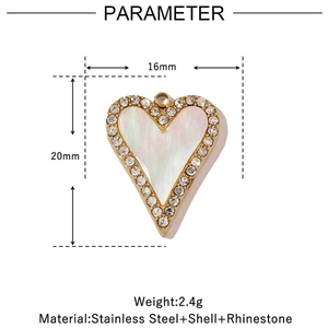 Detail view of a 16mm heart pendant with white shell inlay and rhinestone border