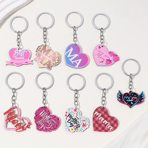 Set of nine colorful heart-shaped MAMA keychains with floral and leopard print patterns