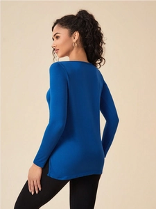 Detail view of royal blue slim fit sports top with stylish side slit hem design
