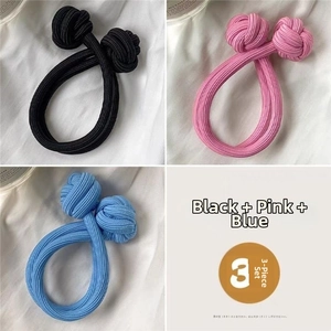 Detailed view of elastic Chinese knot hair ties in black, pink, and blue color options