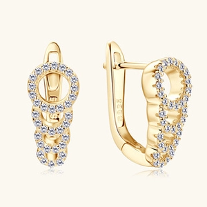 Close-up of S925 sterling silver stamp on gold-plated moissanite hoop earrings