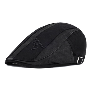 Detail view of black ivy cap showing textured fabric and side letter A embroidery