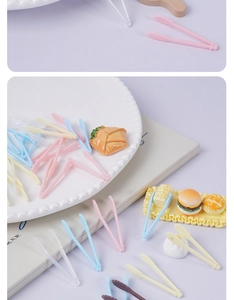 Close-up of colorful mini plastic food tweezers for DIY miniature kitchen dollhouse crafts
