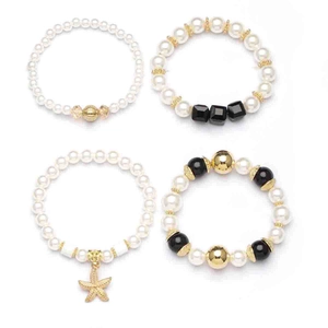 Set of four Bohemian beaded bracelets with pearls, black beads and starfish charm