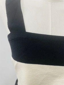 Detailed view of black and white striped knit texture and high-quality stitching craft