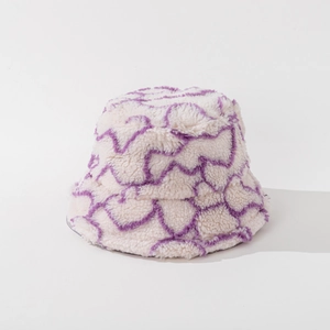 Close-up of cream faux lamb wool bucket hat with purple wavy stripes and soft texture