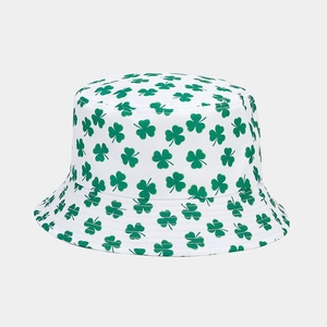 Detailed view of foldable white bucket hat with green shamrock print patterns