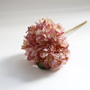 Macro detail of artificial hydrangea petals in pink and beige with burnt edge textures