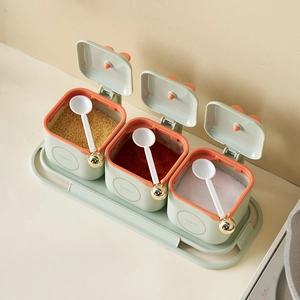 Three-piece kitchen seasoning box set in green and orange with TASTY logo and gold spoons