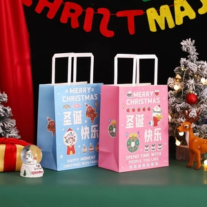 Christmas paper gift bags in pink and blue colors with Merry Christmas festive prints