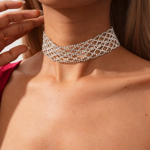 Close-up detail of silver geometric mesh choker featuring full crystal pavé rhinestones