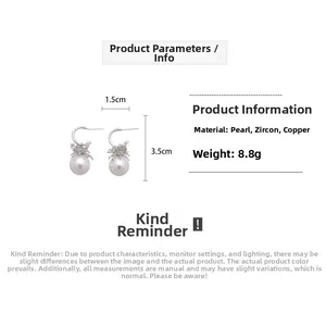 Detailed view of C-shaped pearl earrings with zircon inlay showing 1.5cm by 3.5cm size