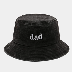 Close-up of DAD embroidery on washed black cotton bucket hat with vent eyelets