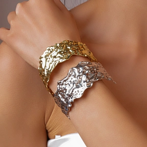 Set of gold and silver textured metallic open bangles with irregular fluid lava design