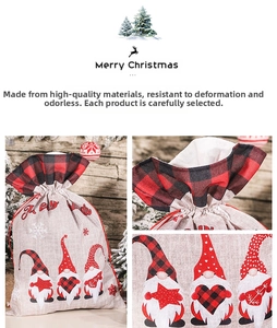 Detailed view of Christmas burlap gnome gift bags with red drawstring and plaid patterns