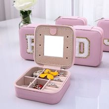 Pink PU leather travel jewelry box detail with inner mirror and ring slots
