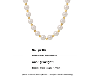 Detail view of 12mm white shell pearls and golden steel beads necklace structure