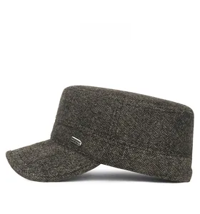 Side view of winter wool ear-flap cap for men showing textured tweed fabric and metal detail