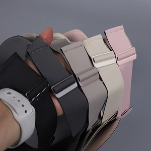 Detail showing five adjustable elastic smartwatch bands in neutral and pastel colors