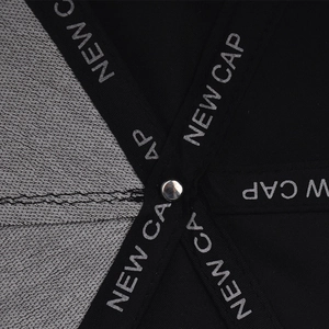 Macro detail of breathable mesh lining and brand tape stitching inside the flat brim cap