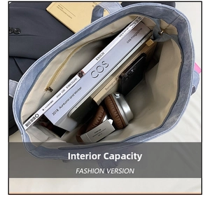 Spacious interior of light blue Oxford tote bag showing zipper pocket and items