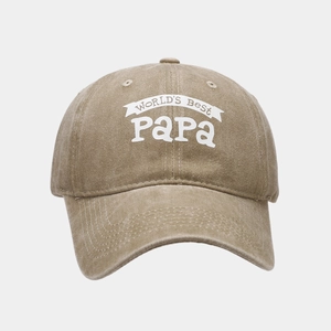 Close-up of vintage washed khaki baseball cap featuring World's Best Papa lettering