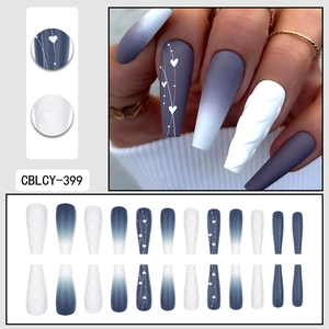 Matte dark blue and white coffin press-on nails with 3D sweater texture and heart patterns