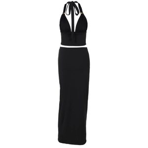 Detail of black two-piece set featuring halter neck top with metal ring and slim skirt