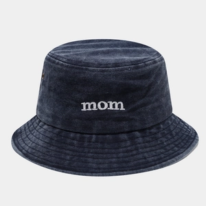 Close-up of MOM embroidery on washed cotton denim bucket hat with white stitching details